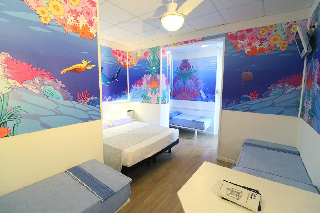 Postel nebo postele na pokoji v ubytování Hotel Fabrizio