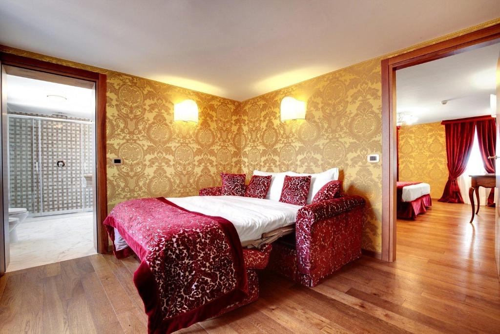 Postel nebo postele na pokoji v ubytování Hotel Casanova