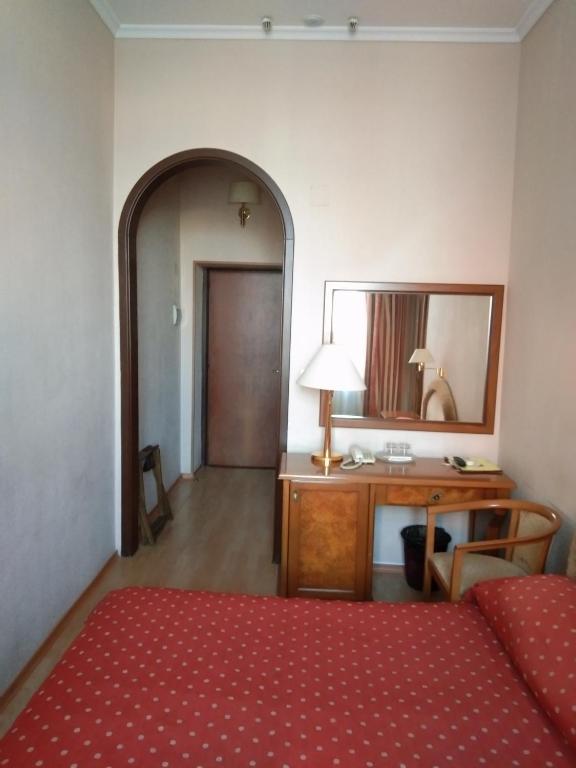 Postel nebo postele na pokoji v ubytování Domus Hotel-1