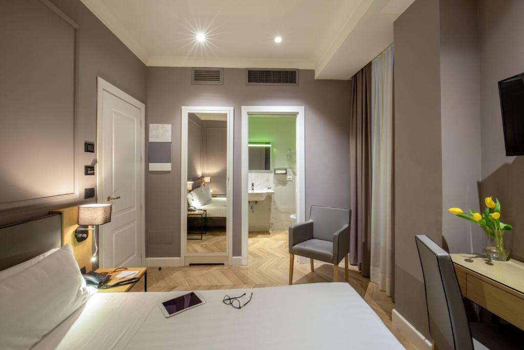 Ein Bett oder Betten in einem Zimmer der Unterkunft Best Western Hotel Astrid