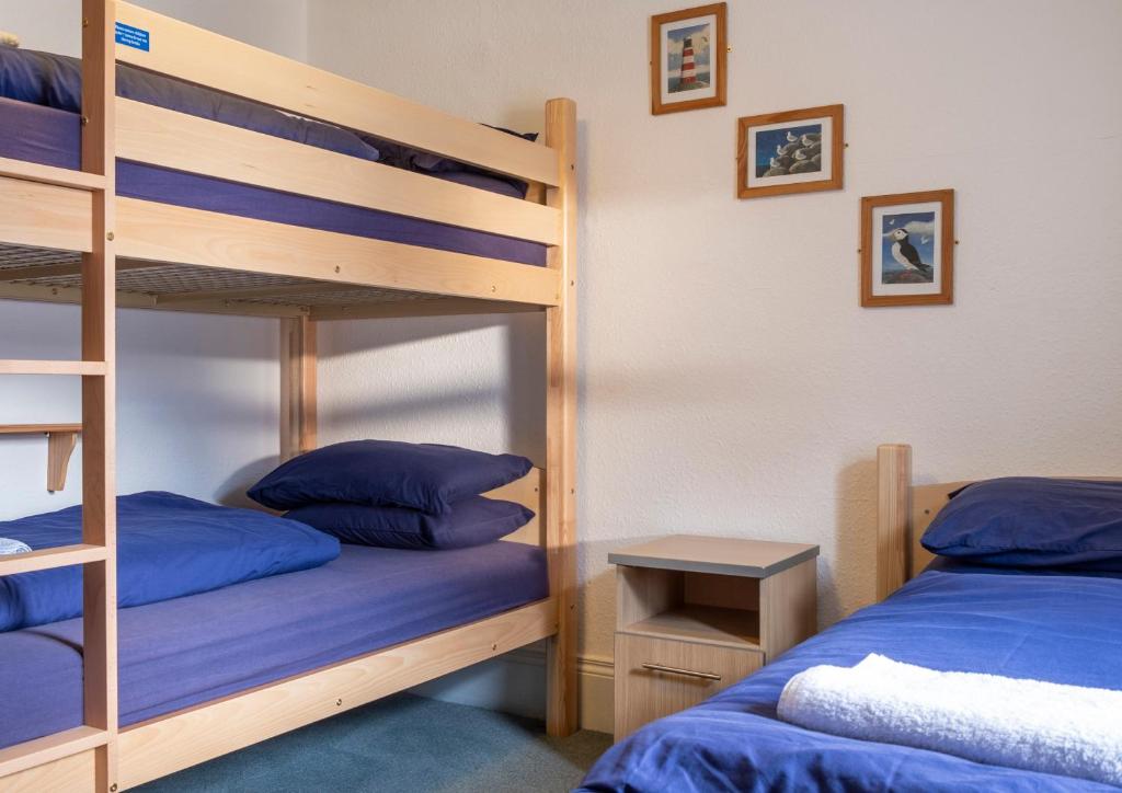 Voodi või voodid majutusasutuse Ullapool Youth Hostel toas