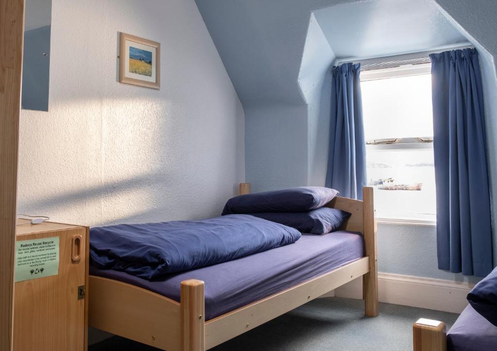 Voodi või voodid majutusasutuse Ullapool Youth Hostel toas