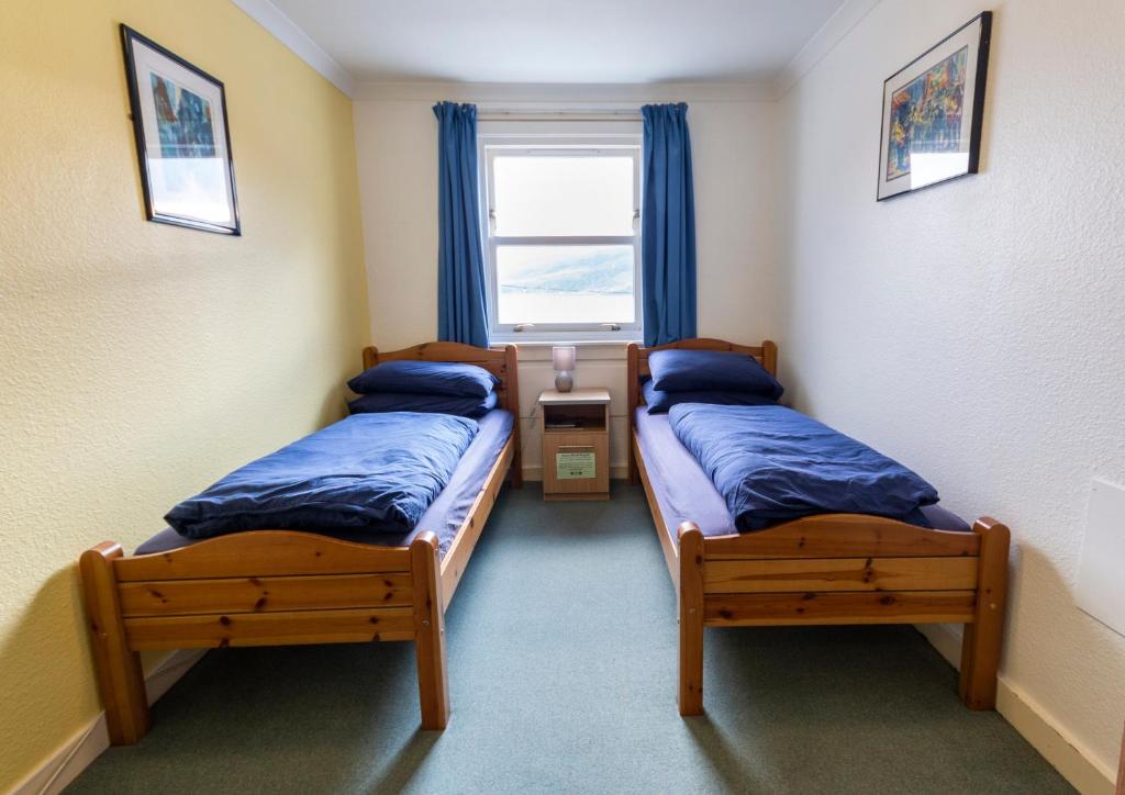 Voodi või voodid majutusasutuse Ullapool Youth Hostel toas