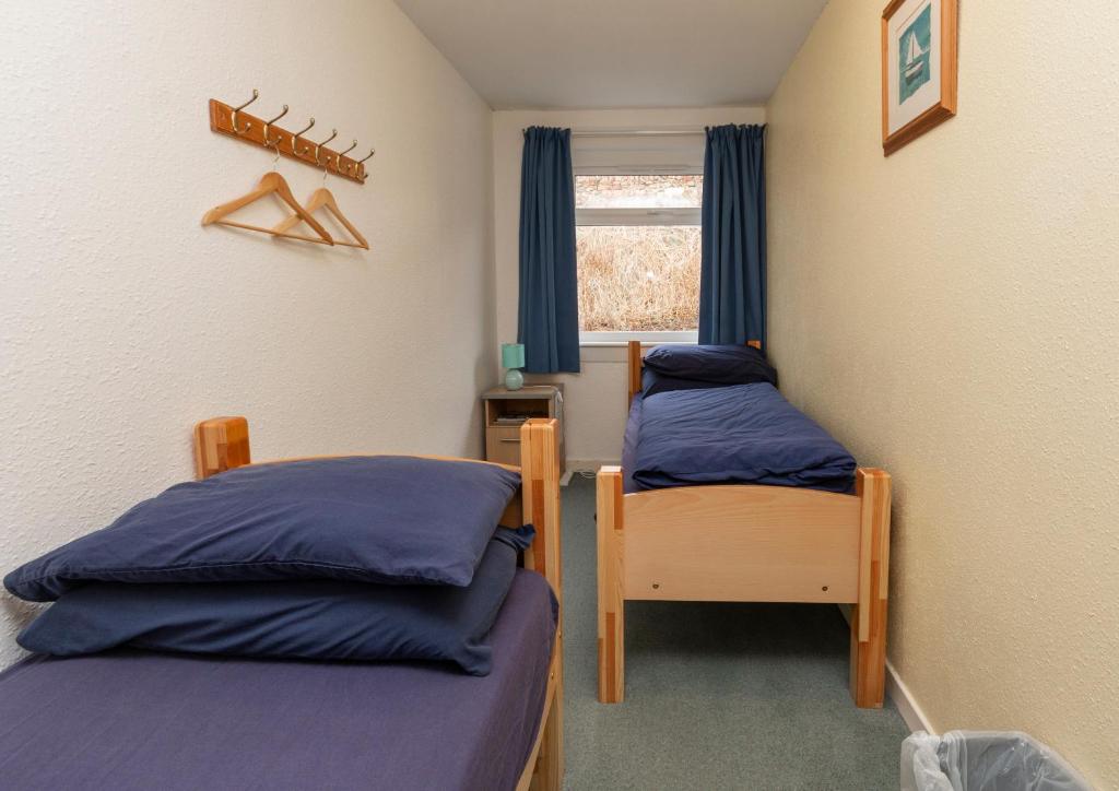 Voodi või voodid majutusasutuse Ullapool Youth Hostel toas