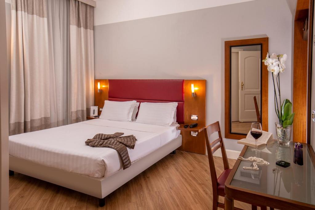 Ein Bett oder Betten in einem Zimmer der Unterkunft Best Western Hotel Astrid