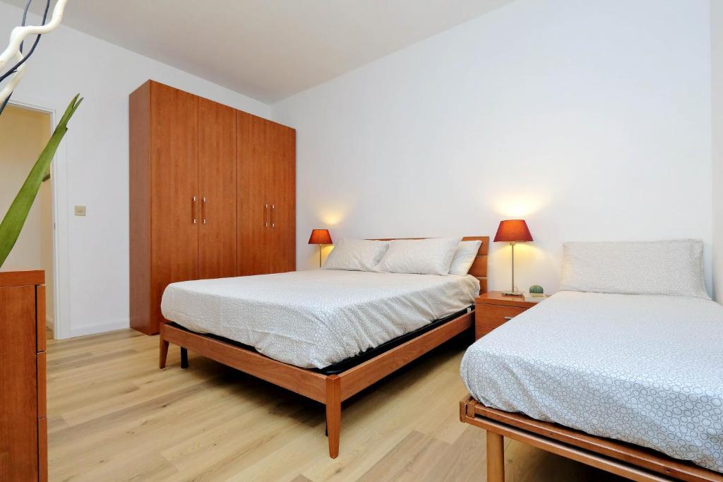 Кровать или кровати в номере Magliana Apartment