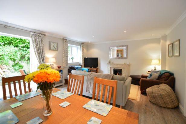 a living room with a dining table and a living room at September Sea in Port Isaac