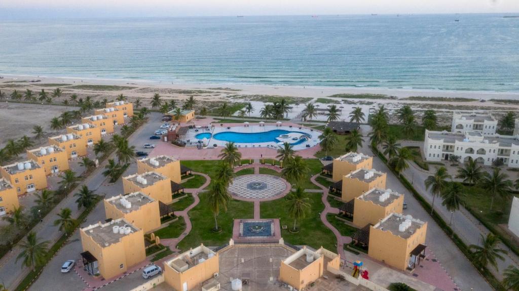 an aerial view of the resort and the beach at Samharam Resort Salalah in Salalah