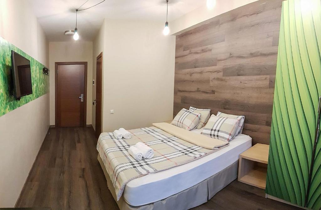 Postel nebo postele na pokoji v ubytování Wine Hotel Chisinau