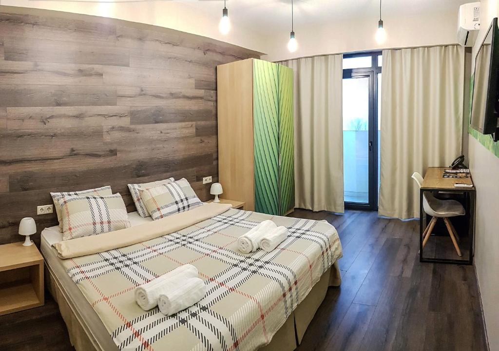 Postel nebo postele na pokoji v ubytování Wine Hotel Chisinau