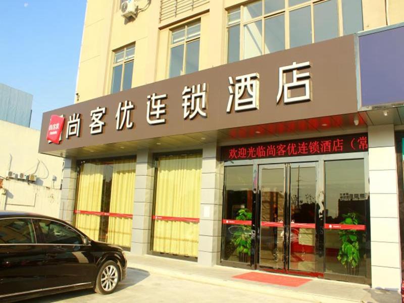 a car parked in front of a building at Thank Inn Chain Hotel jiangsu suzhou changshu city zhitang in Gujiashuigou