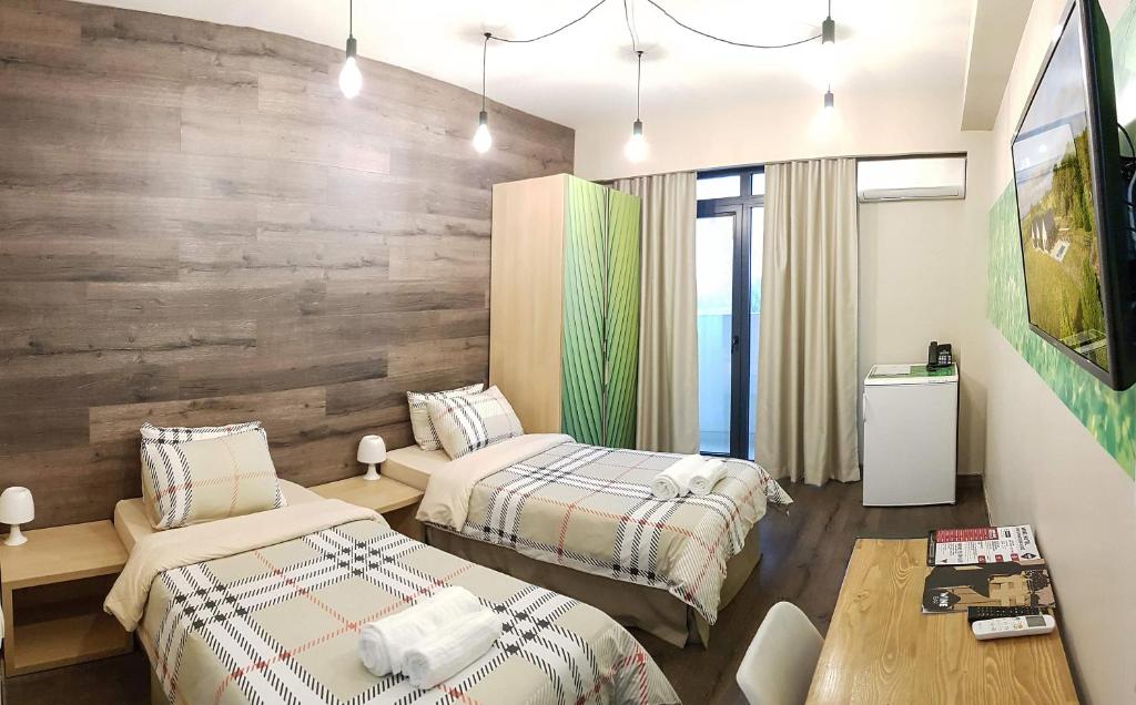 Postel nebo postele na pokoji v ubytování Wine Hotel Chisinau