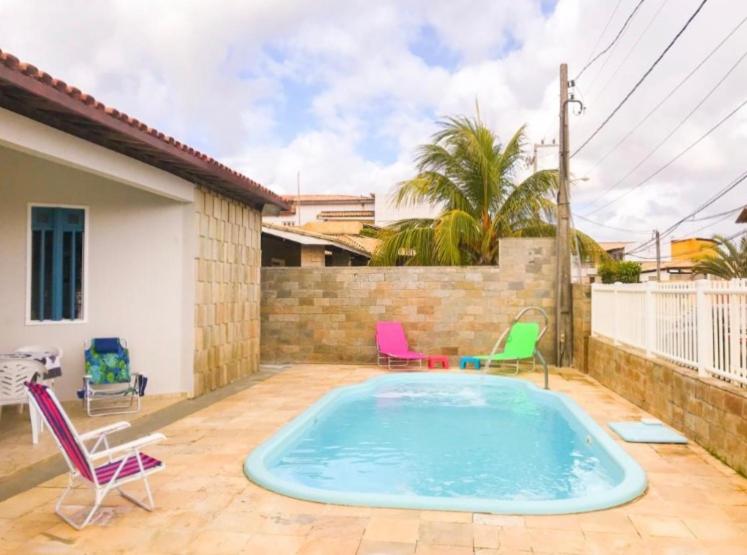  Casa de praia em condomínio fechado com piscina própria
