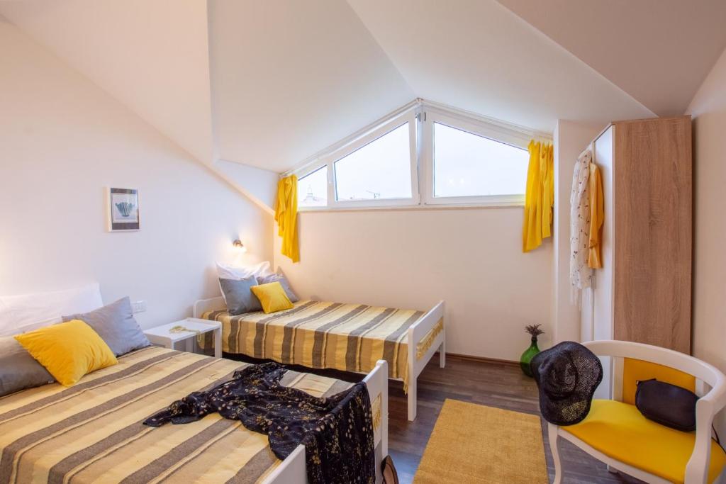 Postel nebo postele na pokoji v ubytování Villa Pax