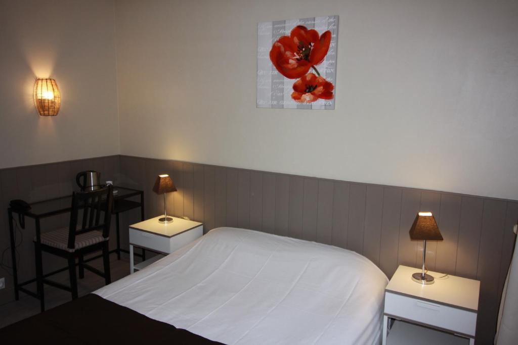Postel nebo postele na pokoji v ubytování Hotel De l'Univers
