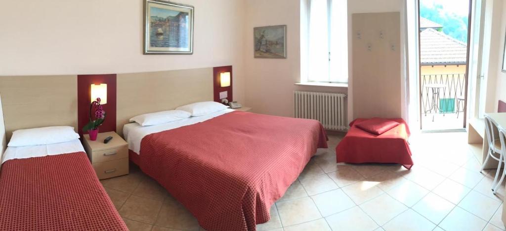 Postel nebo postele na pokoji v ubytování Albergo Riva