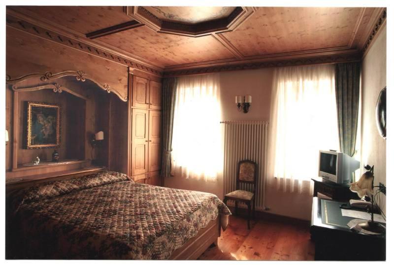 Postel nebo postele na pokoji v ubytování Cadore Haus