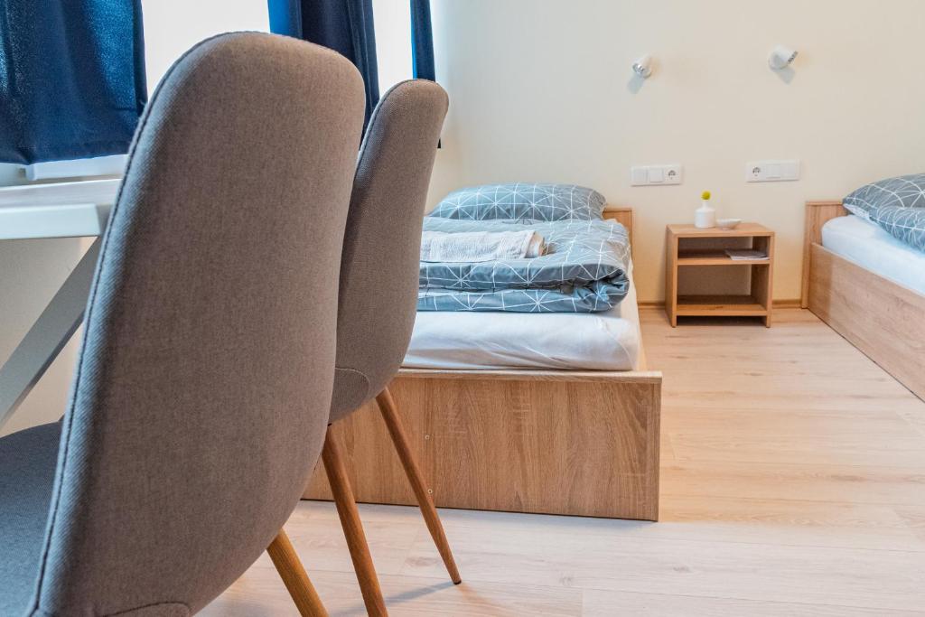 Postel nebo postele na pokoji v ubytování Randevú Panzió