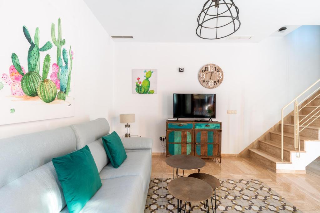 Televízia a/alebo spoločenská miestnosť v ubytovaní Veoapartment Estrella