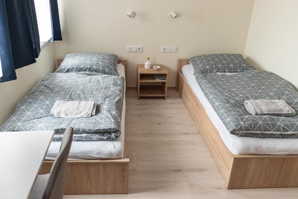 Postel nebo postele na pokoji v ubytování Randevú Panzió