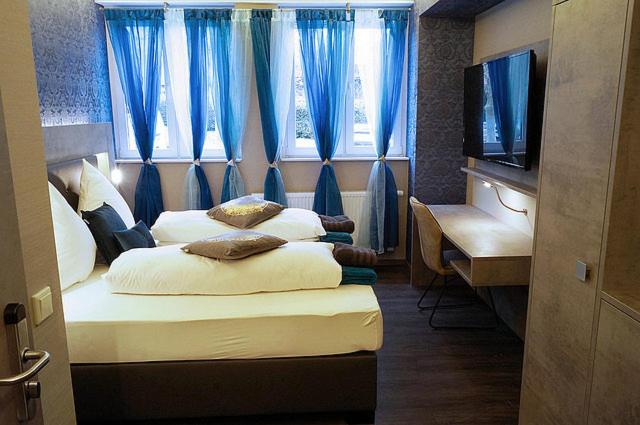 Postel nebo postele na pokoji v ubytování Hotel Diamond