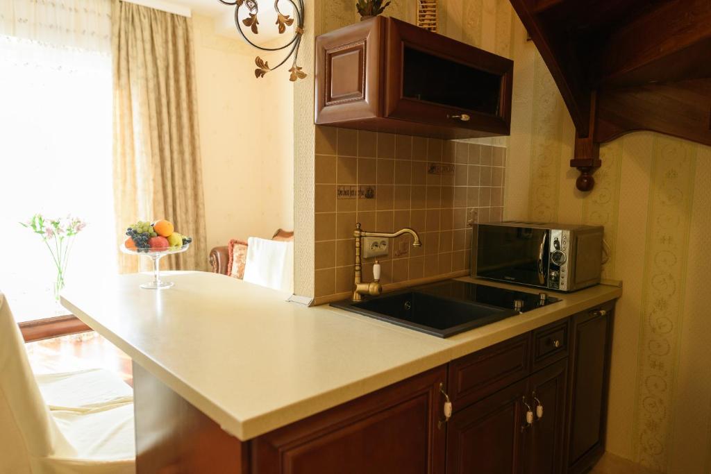 Kuchyň nebo kuchyňský kout v ubytování Apart-Hotel Chale Graal