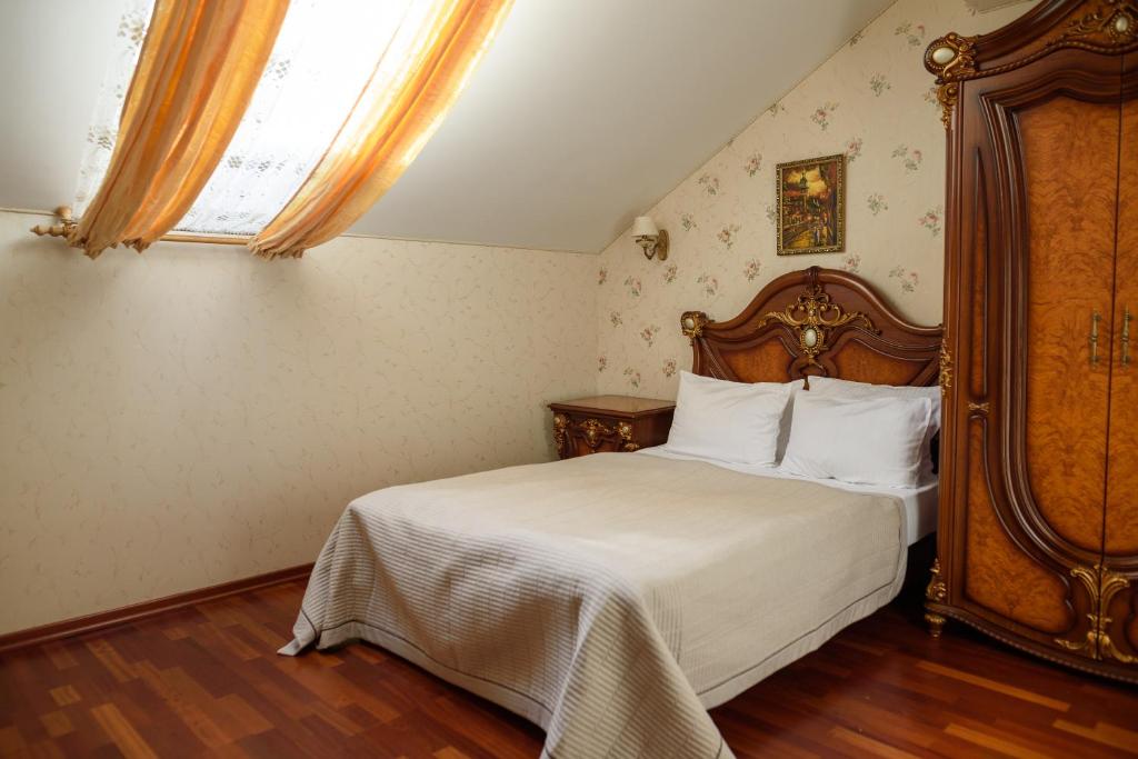 Postel nebo postele na pokoji v ubytování Apart-Hotel Chale Graal