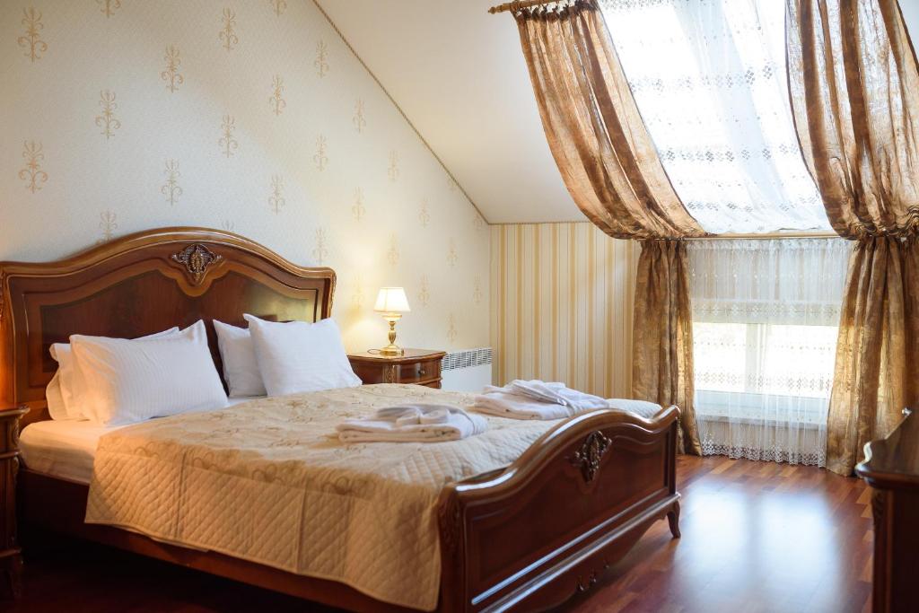 Postel nebo postele na pokoji v ubytování Apart-Hotel Chale Graal