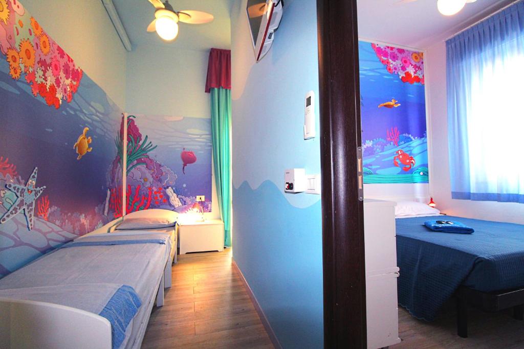 Postel nebo postele na pokoji v ubytování Hotel Fabrizio