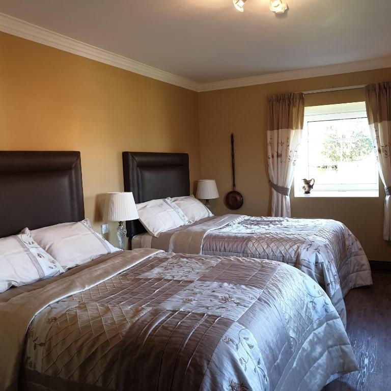 Letto o letti in una camera di Cloghan Lodge