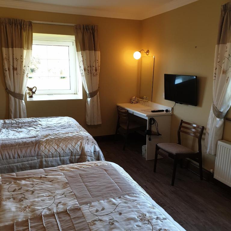Letto o letti in una camera di Cloghan Lodge