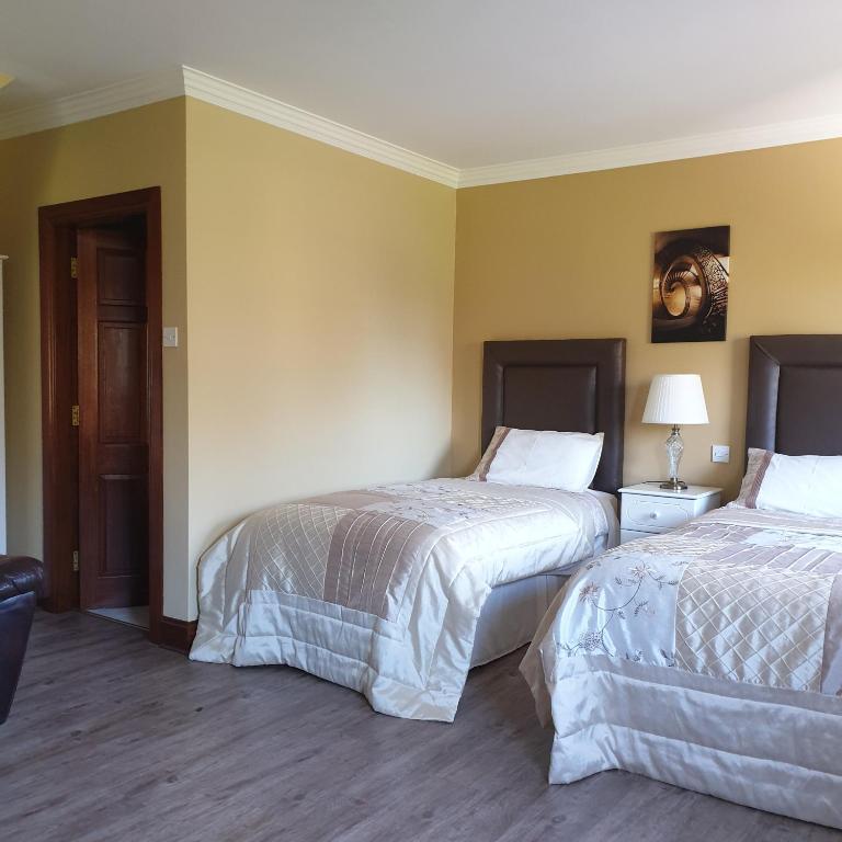 Letto o letti in una camera di Cloghan Lodge