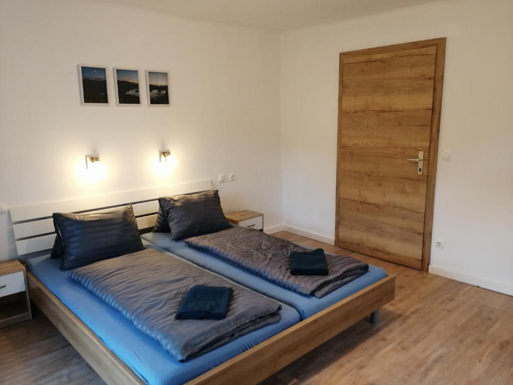 Postel nebo postele na pokoji v ubytování Parkweg Lodge