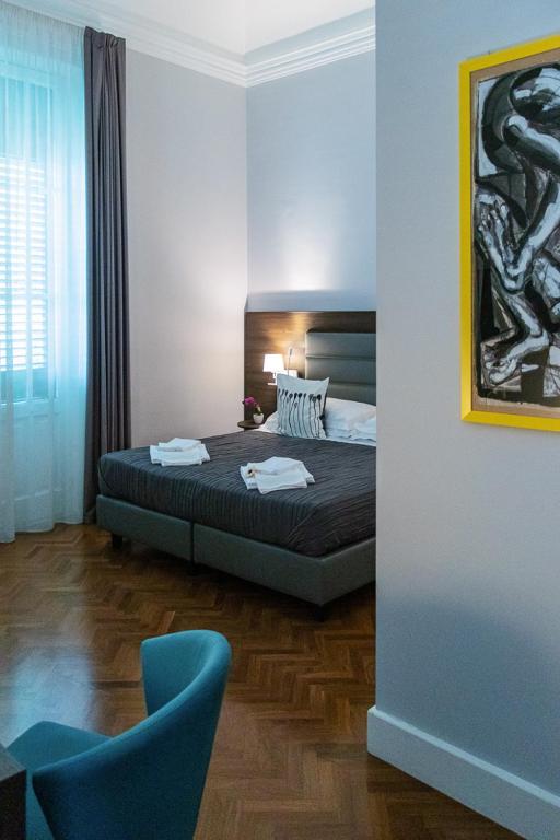 Postel nebo postele na pokoji v ubytování Re Vittorio De Luxe
