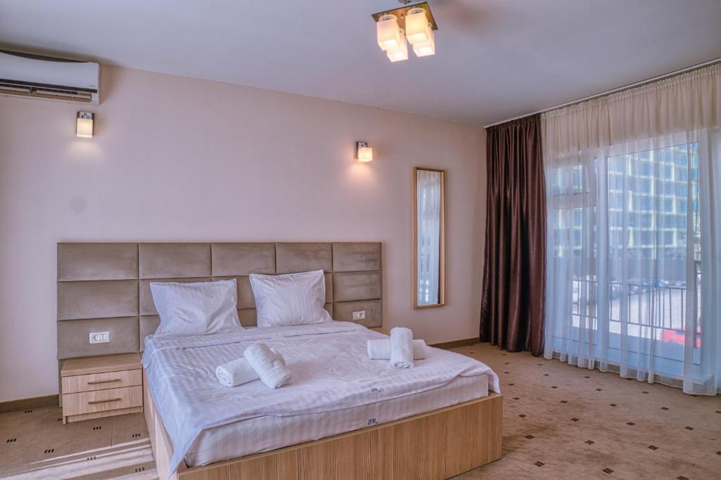 Postel nebo postele na pokoji v ubytování Sammos Beach Resort