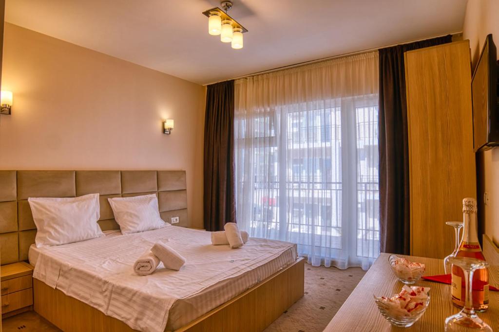 Postel nebo postele na pokoji v ubytování Sammos Beach Resort