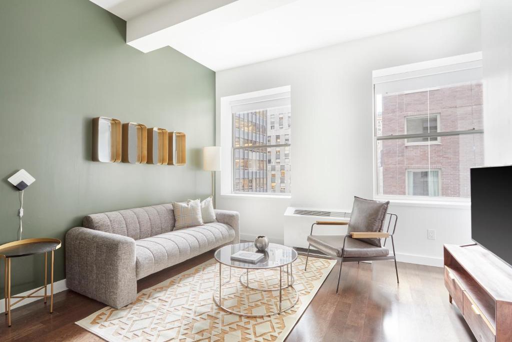 
a living room filled with furniture and a window at Sonder at One Platt in New York

