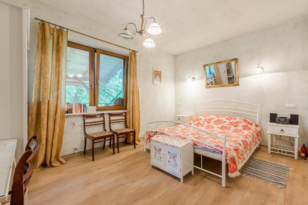 Postel nebo postele na pokoji v ubytování Domki nad Jeziorem