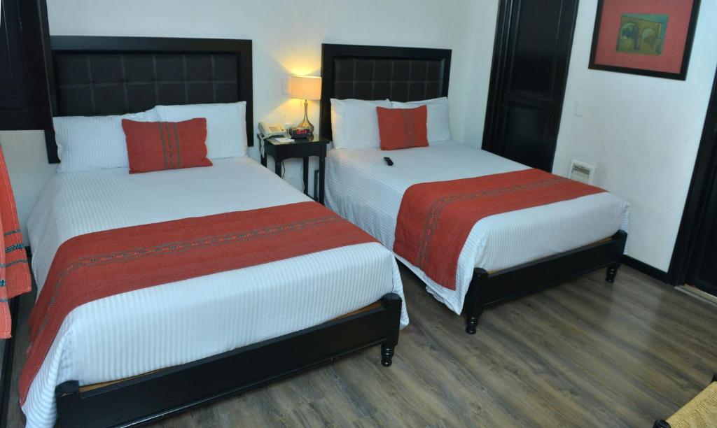 Postel nebo postele na pokoji v ubytování Best Western Plus Posada de Don Vasco