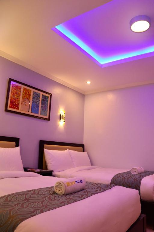 Postel nebo postele na pokoji v ubytování MAISON HOTEL