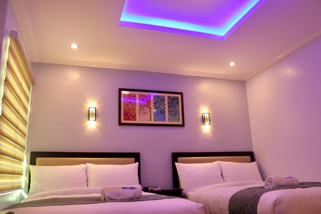 Postel nebo postele na pokoji v ubytování MAISON HOTEL