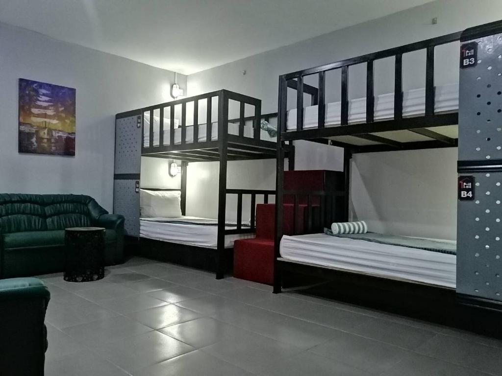 Postel nebo postele na pokoji v ubytování Sabai Place Donmueang Airport