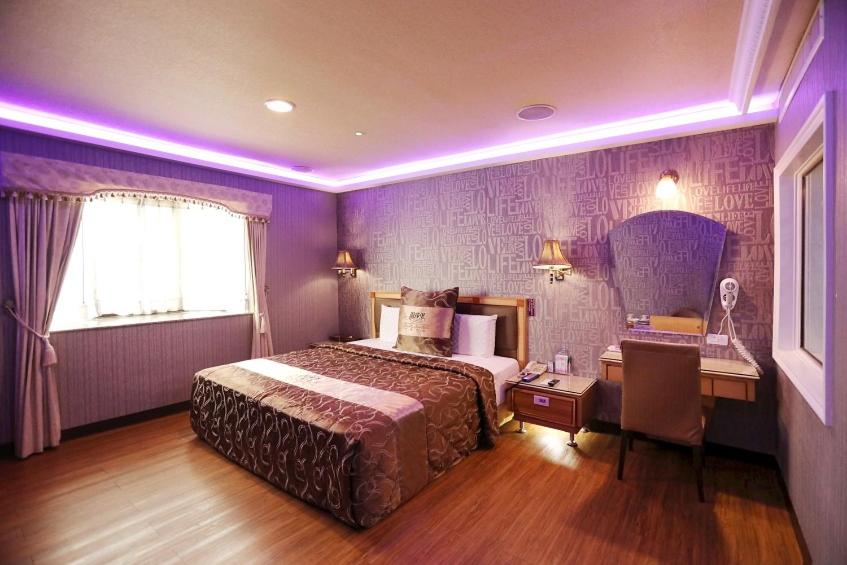 Postel nebo postele na pokoji v ubytování Wen Sha Bao Motel-Xinying