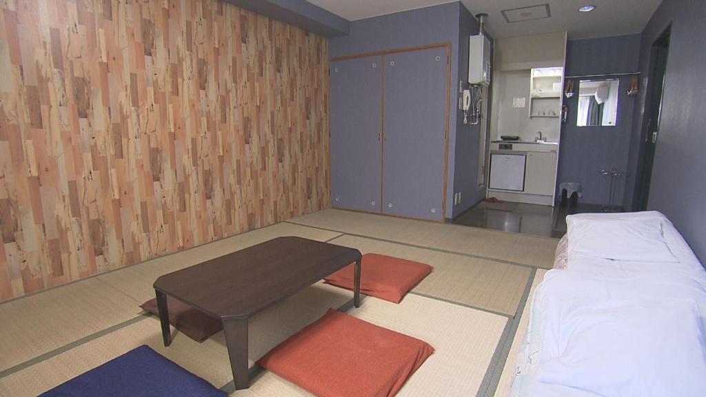 Postel nebo postele na pokoji v ubytování Asano Hotel