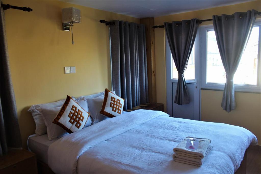 Kiwi Backpackers Hostel Pokhara 객실 침대