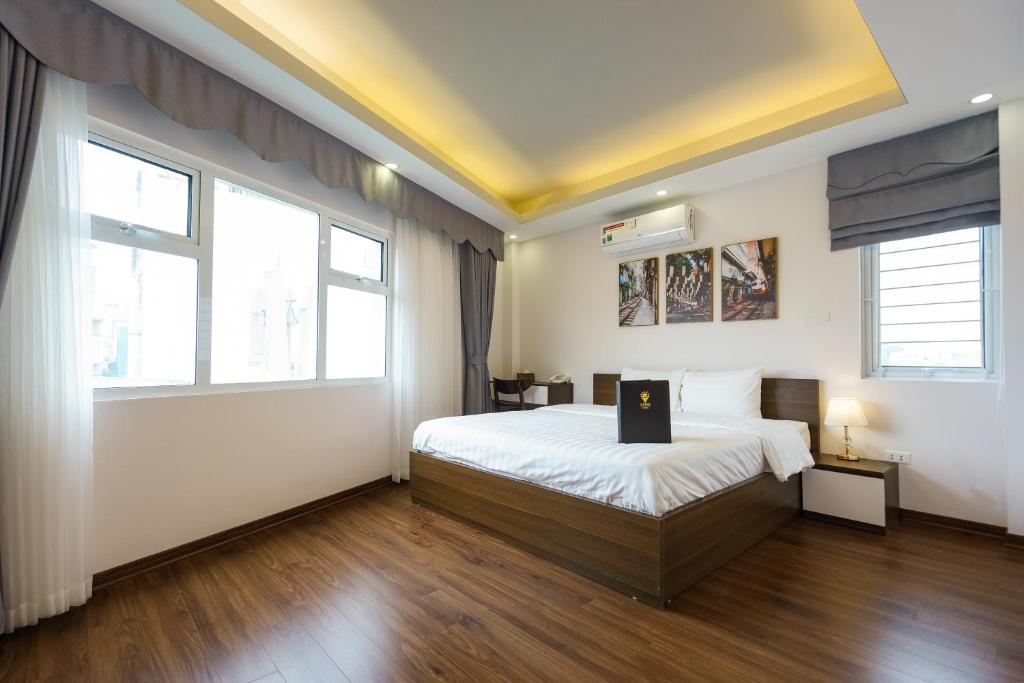 Postel nebo postele na pokoji v ubytování Hanoi Veris Boutique Hotel & Spa