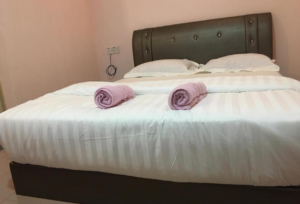 Postel nebo postele na pokoji v ubytování Anderson Hotel