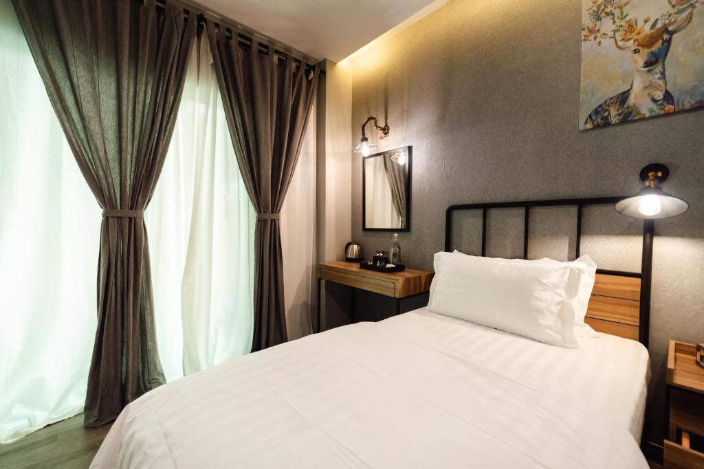Postel nebo postele na pokoji v ubytování SVOK Hotel
