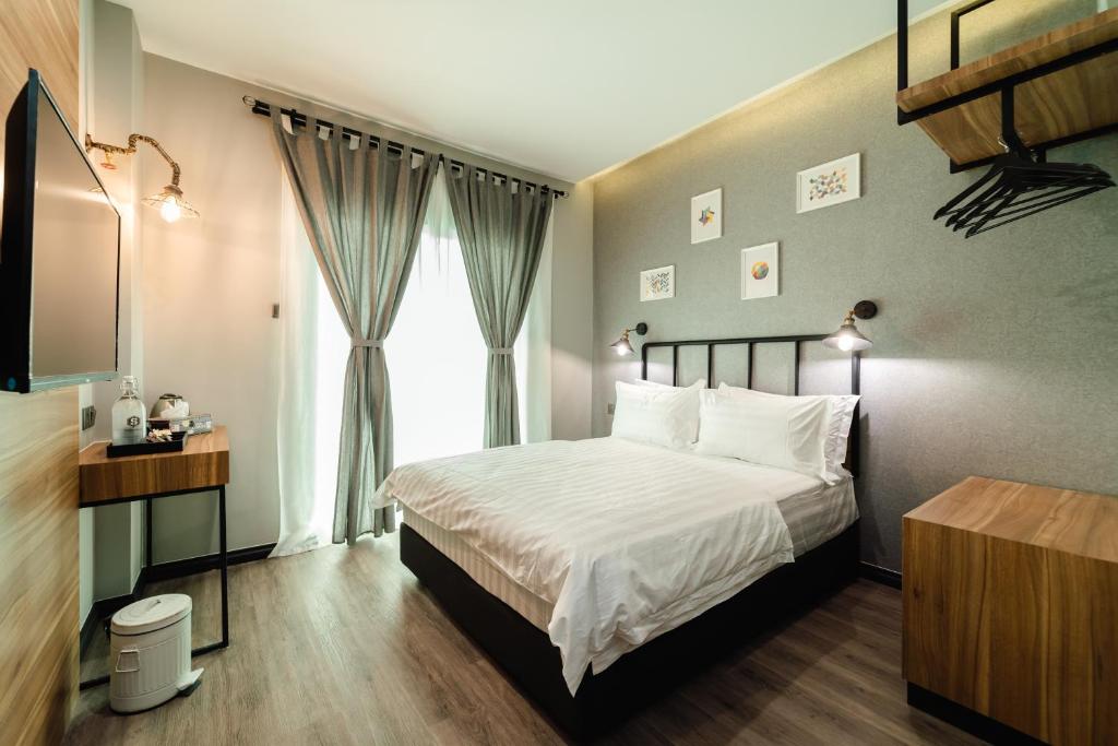 Postel nebo postele na pokoji v ubytování SVOK Hotel