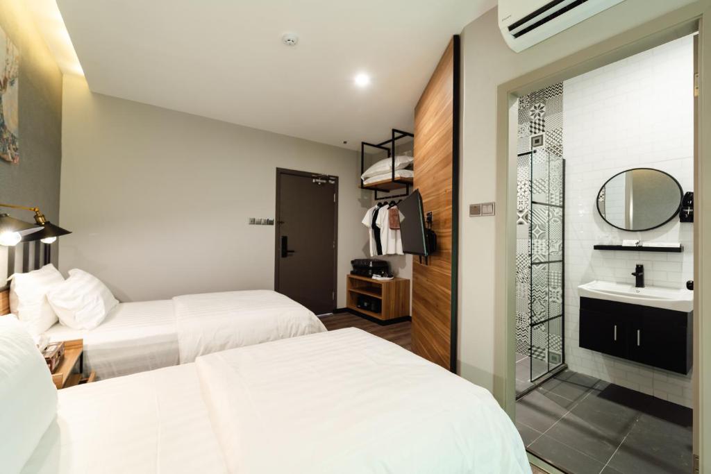 Postel nebo postele na pokoji v ubytování SVOK Hotel